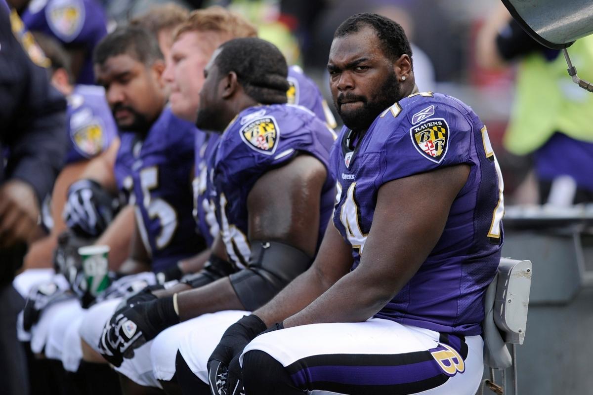 Baltimore Ravens offensive tackle Michael Oher sits on the beach during the first half of an NFL football game against the Buffalo Bills in Baltimore on Oct. 24, 2010. (Nick Wass/AP Photo)