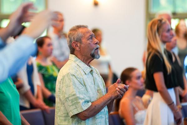 A Maui resident says a prayer during a church service at Kihei Baptist Church in Kihei, Maui, Hawaii, on Aug. 13, 2023. (Allan Stein/The Epoch Times)