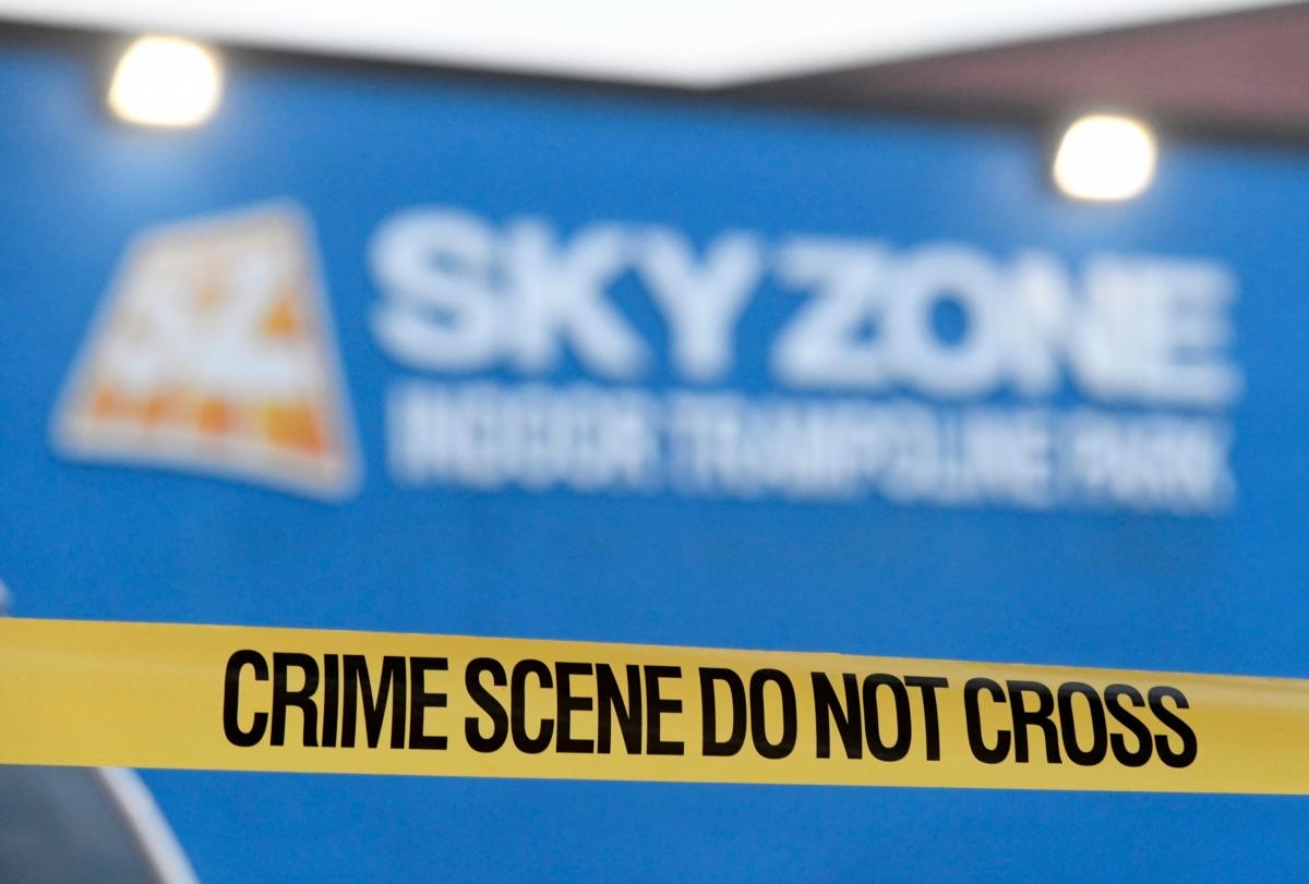 Crime scene tape hangs outside a Sky Zone trampoline park in Timonium, Md., on Aug. 12, 2023. (Steve Ruark/AP Photo)