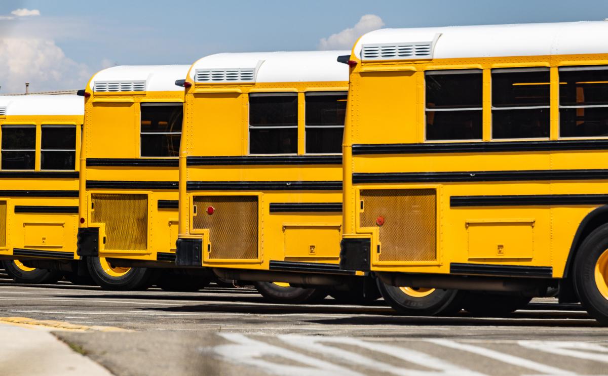 School buses are parked at the Placentia Yorba Linda Unified School District offices in Placentia, Calif., on Aug. 15, 2023. (John Fredricks/The Epoch Times.