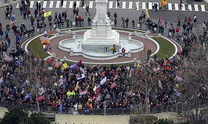 Hundreds of protesters amass just east of the Peace Monument shortly before breaching police barricades on Jan. 6, 2021. (U.S. Capitol Police/Screenshot via The Epoch Times)