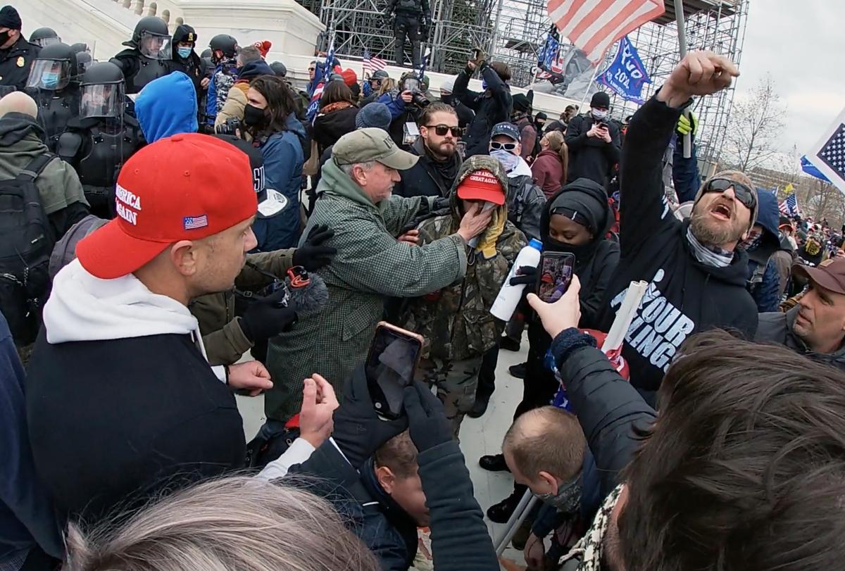 A protester vents his anger at Capitol Police after a fellow demonstrator was shot in the face with a projectile in Washington on Jan. 6, 2021. (Special to The Epoch Times)