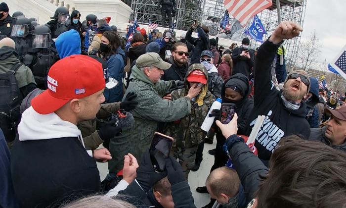 A protester vents his anger at Capitol Police after they shot Joshua Black in the face with a projectile on Jan. 6, 2021. (Special to The Epoch Times)