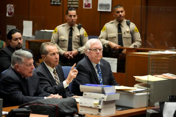 Orange County Superior Court Judge Jeffrey Ferguson (R) sits next to his attorneys John Drummond Barnett (L) and Paul Meyer during a hearing at the Clara Shortridge Foltz Criminal Justice Center in Los Angeles on Aug. 15, 2023. (Damian Dovarganes/AP Photo)