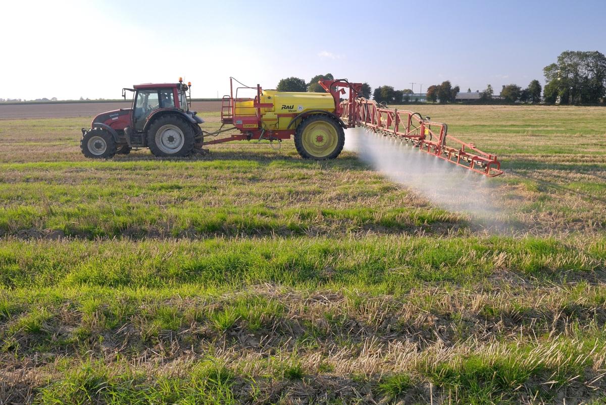 Tractor spreading glyphosate on wheat straw with a spraying machine in Normandy, France, in September 2007. (Leitenberger Photography/Shutterstock)