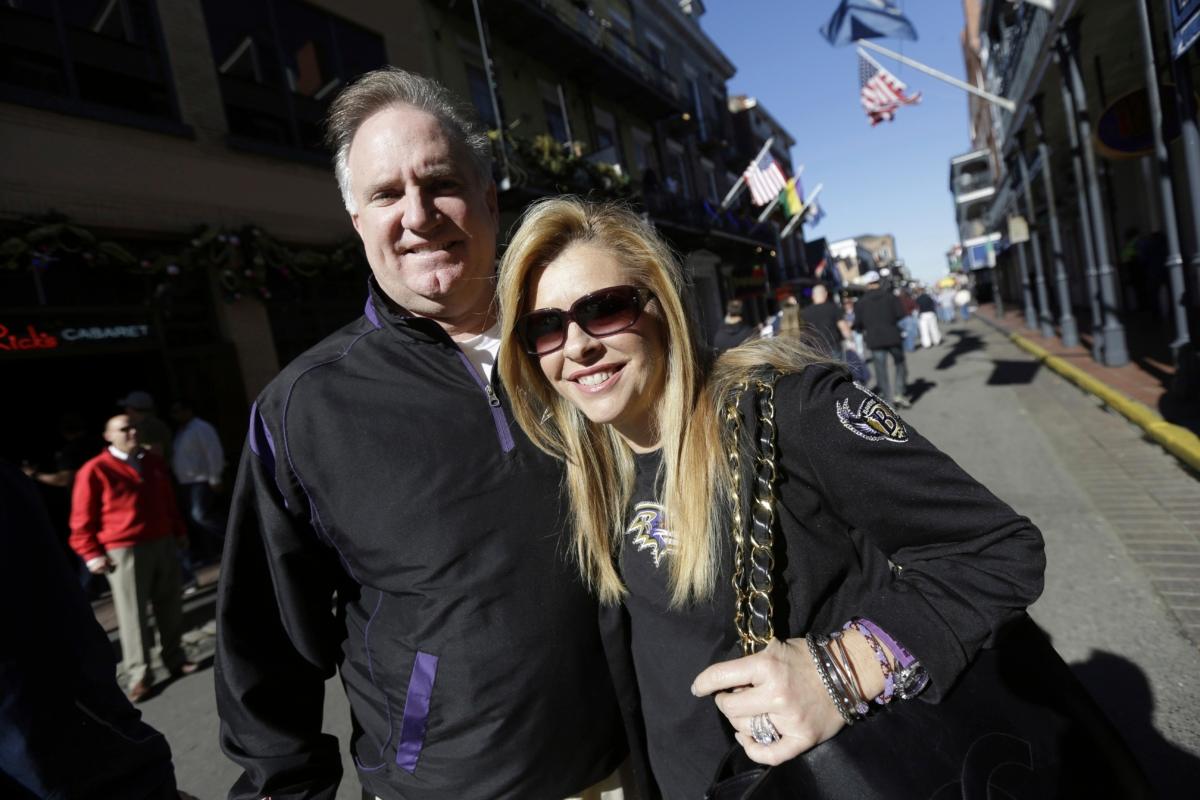 Sean and Leigh Anne Tuohy stand on a street in New Orleans on Feb. 1, 2013. (Gerald Herbert/AP Photo)