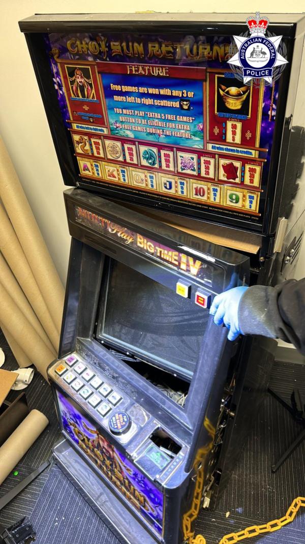 Australian Federal Police (AFP) officers seize 100 grams of suspected methamphetamines hidden in an electronic gaming machine during a raid in Melbourne, Australia on Aug. 16, 2023. (Courtesy of AFP)