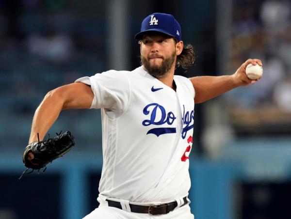 Starting pitcher Clayton Kershaw (22) of the Los Angeles Dodgers throws against the Milwaukee Brewers during the second inning at Dodger Stadium in Los Angeles on Aug. 16, 2023. (Kevork Djansezian/Getty Images)