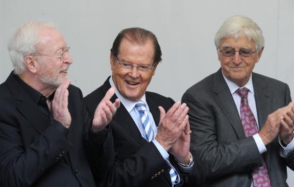 Michael Parkinson (R) with Michael Caine (L) and, Roger Moore (C) during a memorial service for film director Michael Winner on June 23, 2014. (Anthony Devlin/PA)