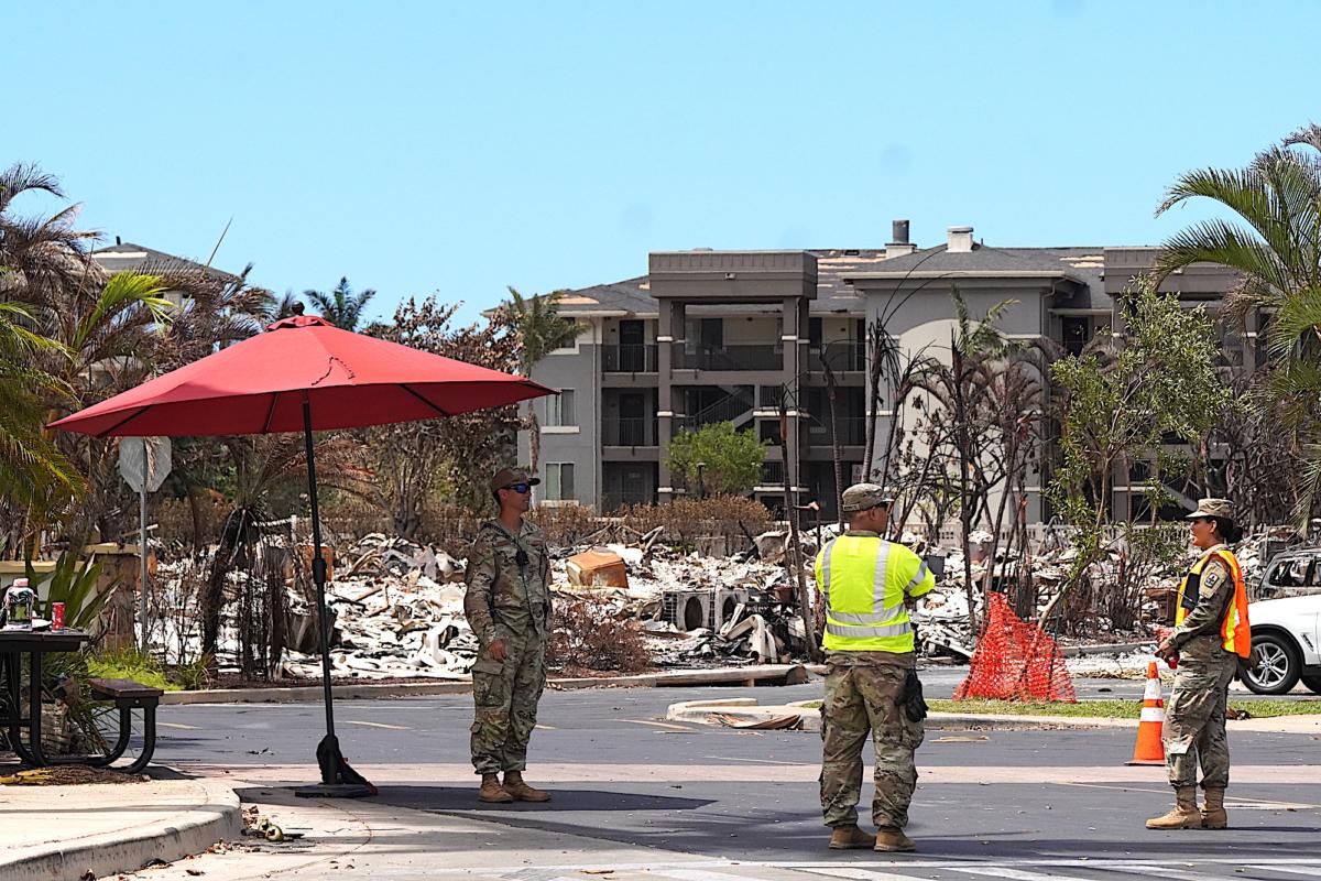 Army National Guard members man the entrance to a prohibited location in Lahaina Town on Aug. 16, 2023. (Allan Stein/The Epoch Times)