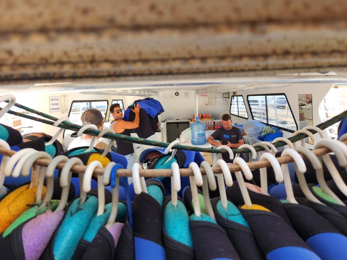 Volunteers stock donated supplies aboard the Lani Kai II in Lahaina, Maui, on Aug. 12, 2023. (Allan Stein/The Epoch Times)