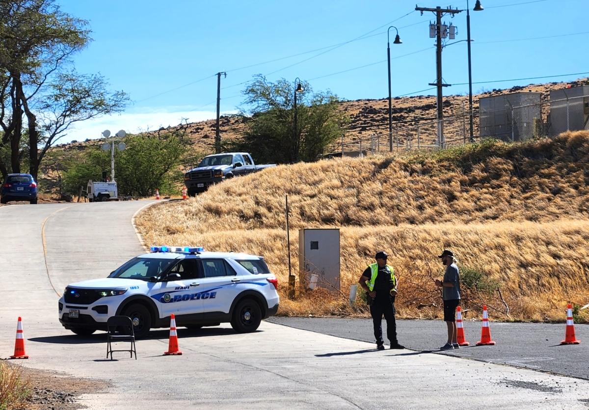 Police cordon off an access road at Buzz's Wharf in Lahaina, West Maui, on Aug. 12, 2023. (Allan Stein/The Epoch Times)