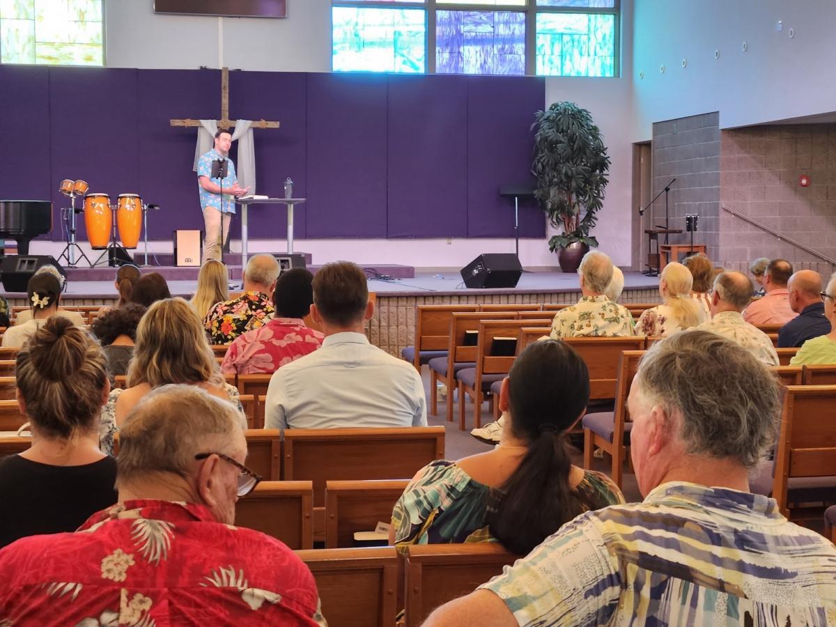 Pastor Van Michael Komatsu of the Kihei Baptist Chapel on Maui delivers a sermon to the grieving survivors of the Lahaina wildfire disaster on Aug. 13, 2023. (Allan Stein/The Epoch Times).