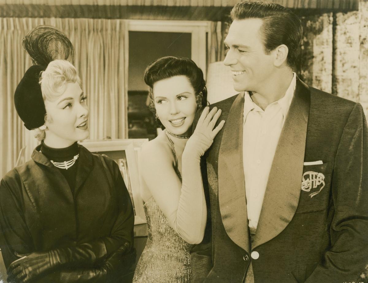 A publicity still for the 1953 film "Kiss Me, Kate" starring (L-R) Kathryn Grayson, Ann Miller, and Howard Keel. (MovieStillsDB)