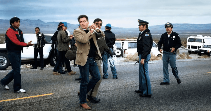 Actor Martin Sheen (foreground) is arrested during a protest near a nuclear-weapons test facility in Nevada in 1988. The image is featured in the documentary "Downwind," which Sheen narrates. (Backlot Docs)