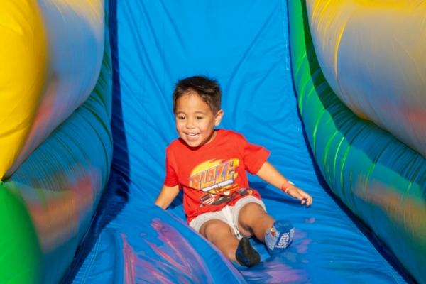 A child plays on inflatable slides at Orange County Great Park in Irvine, Calif. (Courtesy of PSQ Productions)
