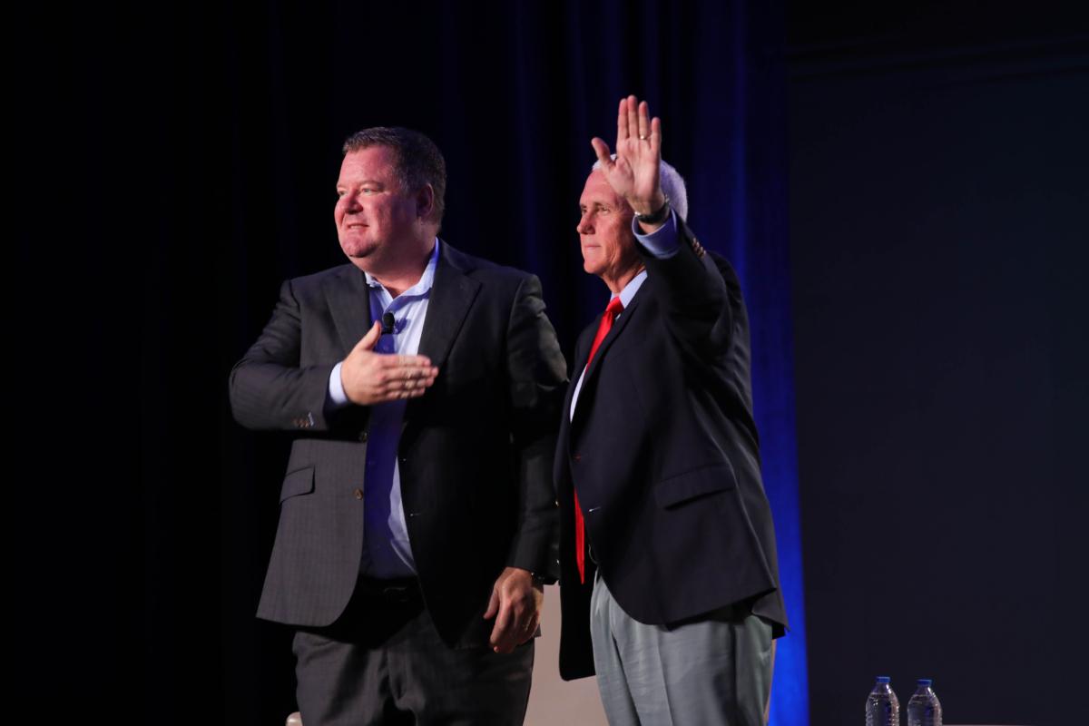 Conservative talk show host Erick Erickson (L) and former Vice President Mike Pence at The Gathering at the Grand Hyatt Hotel in Atlanta's Buckhead neighborhood on Aug. 18, 2023. (Justin Kase for The Epoch Times.)