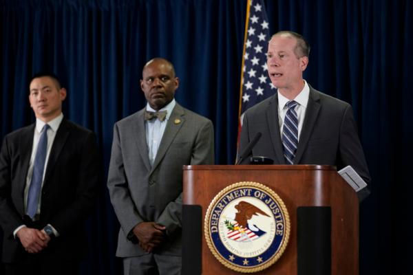 Robert Tripp, special agent in charge of the FBI's San Francisco Field Office, right, speaks to reporters during a press conference to announce federal authorities have charged 9 current and former Northern California police officers in a corruption investigation in San Francisco on Aug. 17, 2023. (Godofredo A. Vásquez/AP Photo)