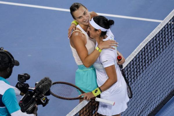 Aryna Sabalenka of Belarus hugs Ons Jabeur of Tunisia after their quarterfinal match at the Western & Southern Open at Lindner Family Tennis Center in Mason, Ohio, on August 18, 2023. (Aaron Doster/Getty Images)