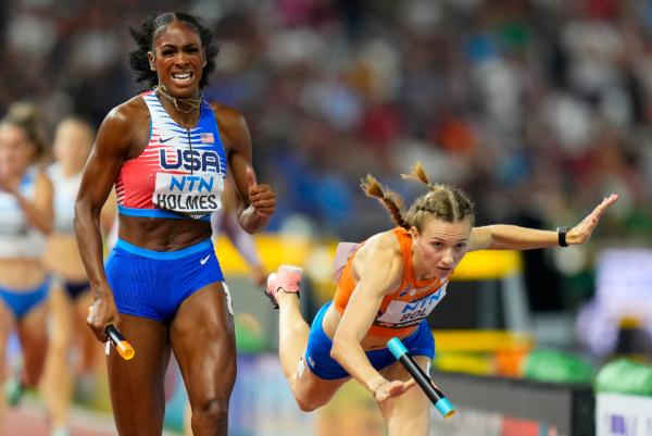 Alexis Holmes, of the United States anchors her team to the gold medal as Femke Bol, of the Netherlands fell near the finish in the final of the 4x400-meters mixed relay during the World Athletics Championships in Budapest, Hungary, on Aug. 19, 2023. (Petr David Josek/AP Photo)