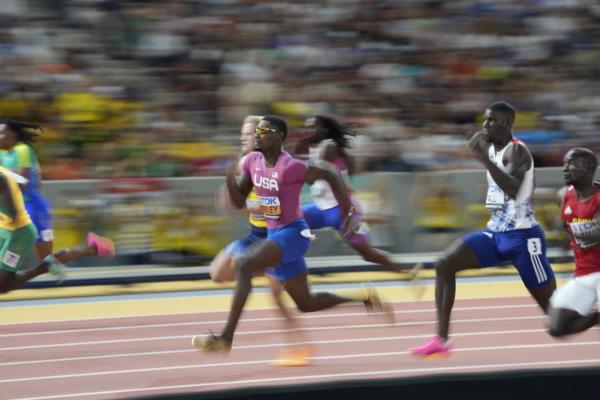 Fred Kerley, of the United States,, center, competes in a Men's 100-meter heat during the World Athletics Championships in Budapest, Hungary, on Aug. 19, 2023. (Matthias Schrader/AP Photo)