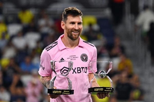 Inter Miami's Argentine forward (10) Lionel Messi poses with the awards for Best Player and Top Scorer after Inter Milan won the Leagues Cup final football match against Nashville SC at Geodis Park in Nashville, Tenn., on Aug. 19, 2023. (Chandan Khan/AFP via Getty Images)