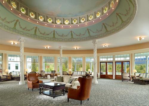 The oval-shaped conservatory room with sweeping views of Mount Washington and the Presidential mountain range. (Courtesy of Omni Mount Washington Resort)