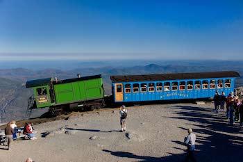 A group of passengers get ready to board the Mount Washington Railway and descend from the summit. (Courtesy of Mount Washington Cog Railway)