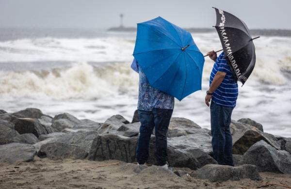 Local residents observe storms brought by Tropical Storm Hillary in Seal Beach, Calif., on Aug. 20, 2023. (John Fredricks/The Epoch Times)