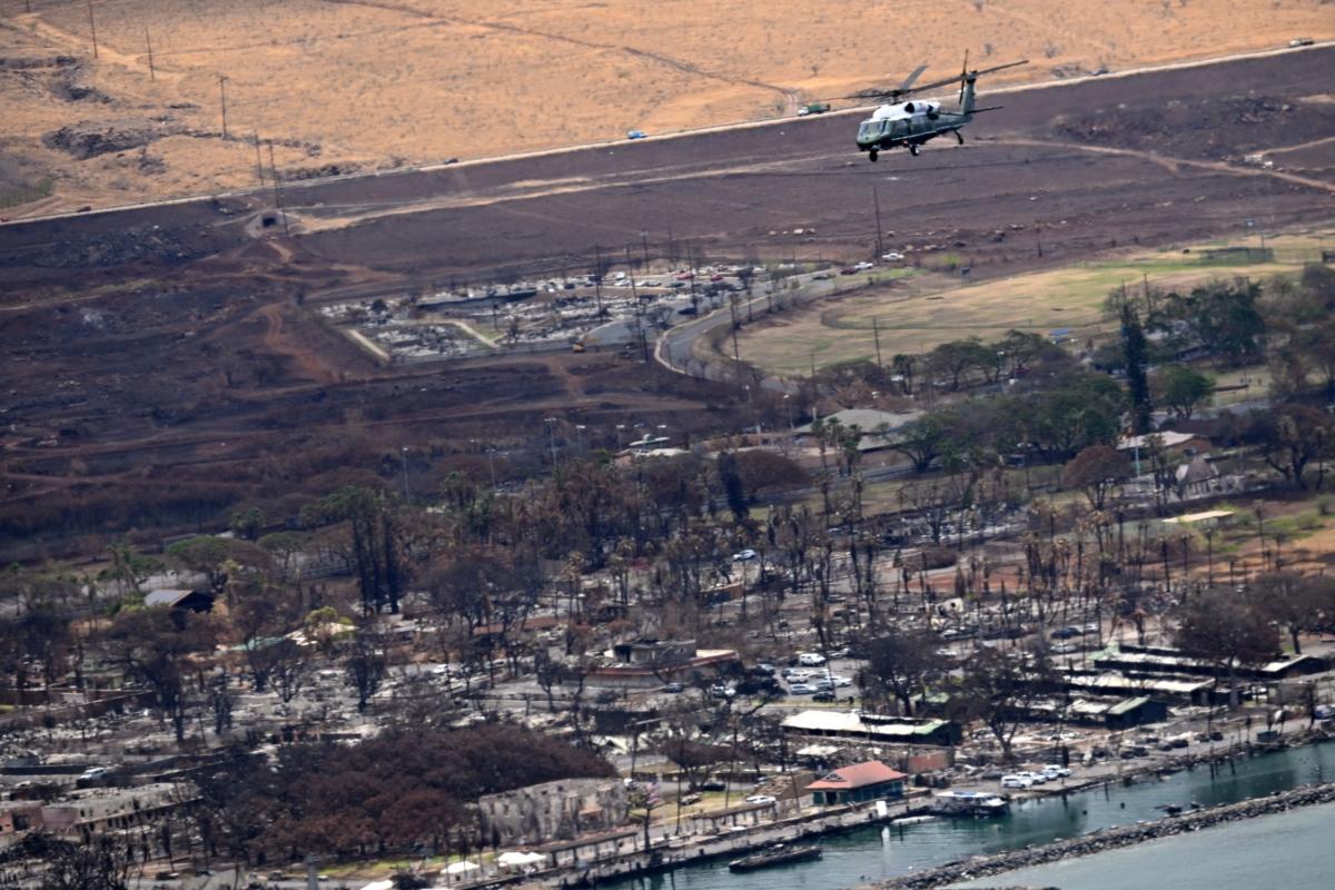 Marine One, carrying US President Joe Biden, flies above wildfire damage in Lahaina on the island of Maui, in Hawaii on Aug. 21, 2023. (Mandel Ngan/AFP via Getty Images)
