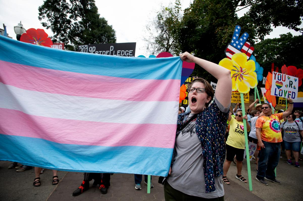  An activist promoting transgenderism holds up a flag at an event in Atlanta, Ga., on Oct. 12, 2019. (Robin Rayne/AP)