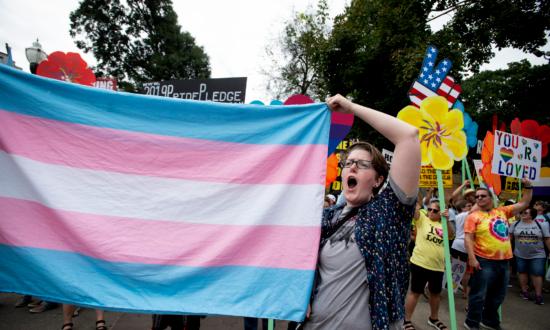 A demonstrator holds up a transgender flag at an LGBT Pride event in Atlanta, Ga., on Oct. 12, 2019. (Robin Rayne/AP Photo)
