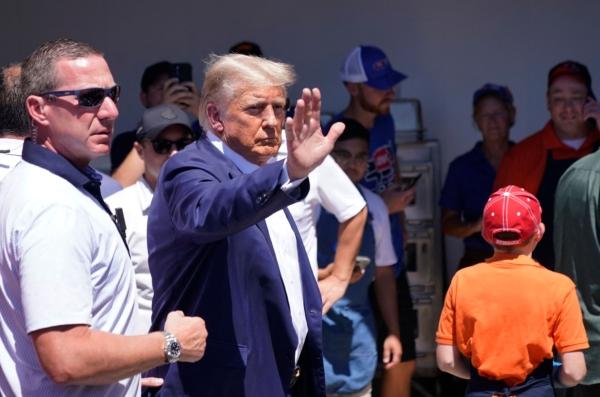 2024 presidential hopeful and former President Donald Trump visits the Iowa Pork Producers Tent during the Iowa State Fair in Des Moines, Iowa, on Aug. 12, 2023. (Stefani Reynolds/AFP via Getty Images)