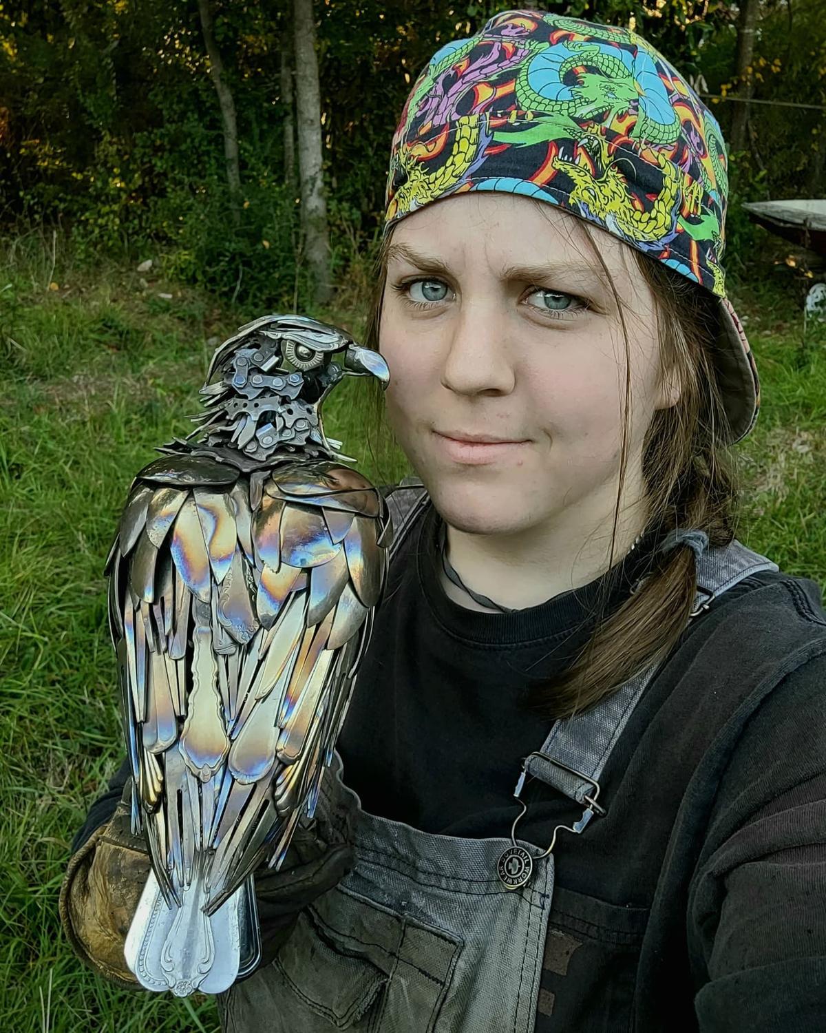 Leah Jeffrey with a metal piece that she sculpted. (Courtesy of <a href="https://www.instagram.com/bruised_reed_studio/">Leah Jeffery</a>)