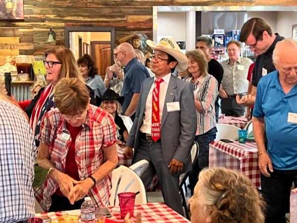 Supporters of former Trump attorney John Eastman listening to his speech at a private event held at a ranch in northern Orange County, Calif., on Aug. 19, 2023. (Brad Jones/The Epoch Times)