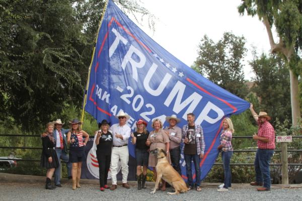 Supporters of former Trump attorney John Eastman pose for a photo at a private event held at a ranch in northern Orange County, Calif., on Aug. 19, 2023. (Brad Jones/The Epoch Times)