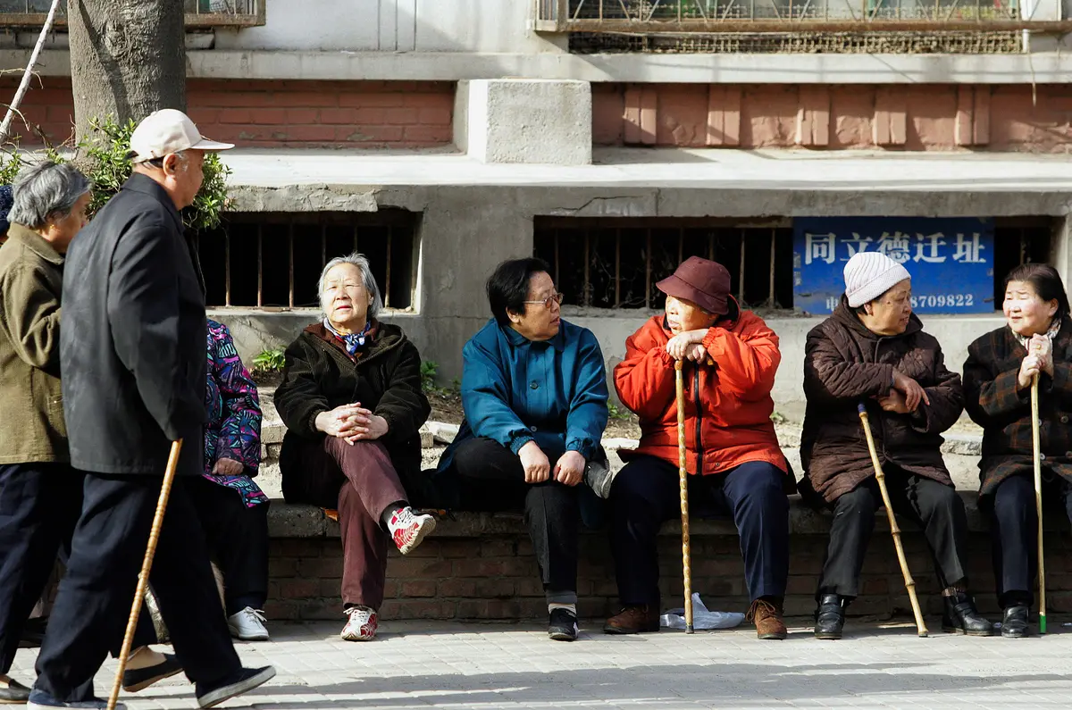 A group of elderly Chinese people enjoys a day in Beijing on April 7, 2007. (AFP/AFP via Getty Images)