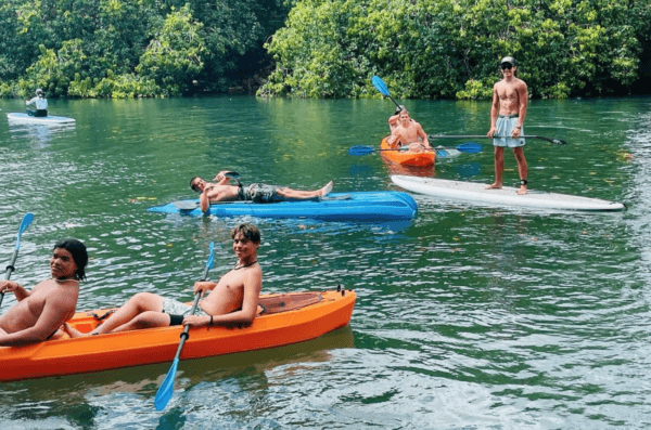 Villa Park High School football teammates kayaking and paddle-boarding during its season-opening trip in Oahu, Hawaii, on Aug. 10, 2023. (Courtesy of Dusan Ancich via Instagram/Screenshot via The Epoch Times)