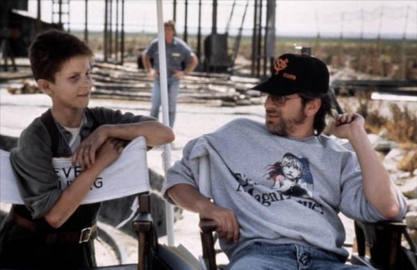 Christian Bale, L, and director Steven Spielberg on the set of "Empire of the Sun." (Warner Bros.)