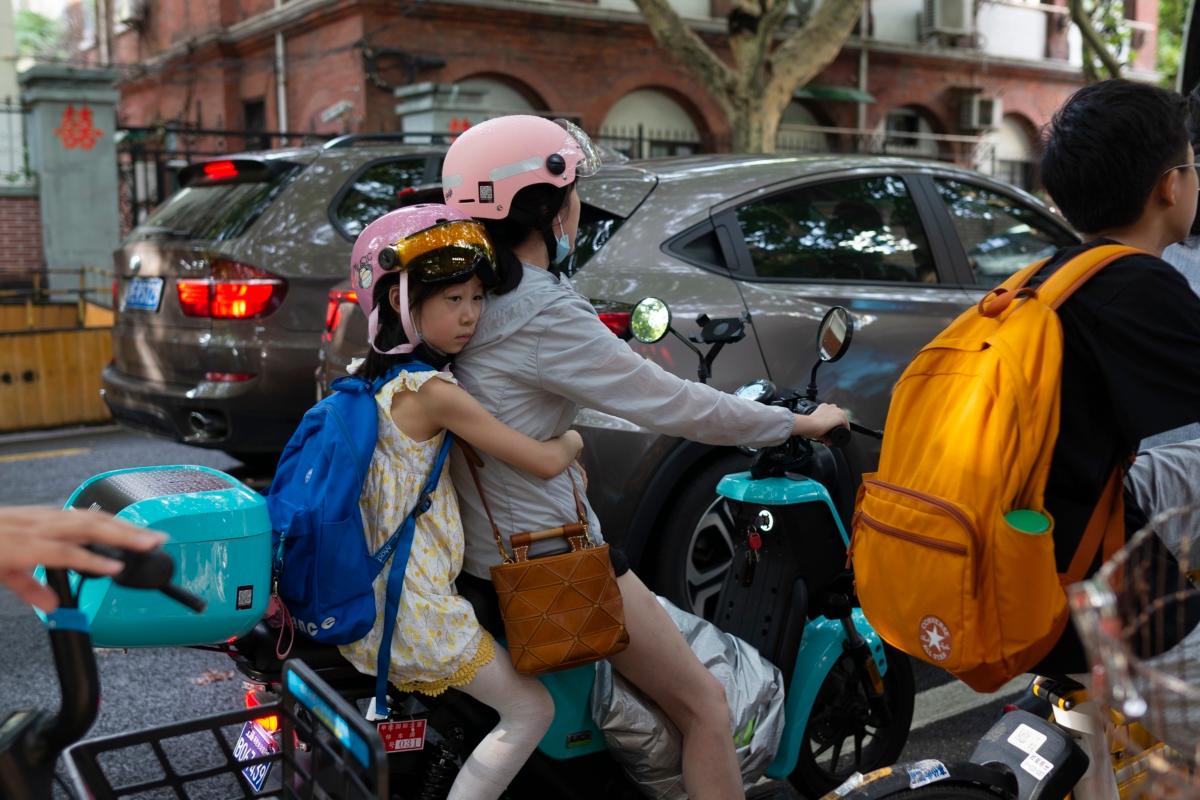 Commuters in Shanghai, China, on Sept. 11, 2021. (Hu Chengwei/Getty Images)