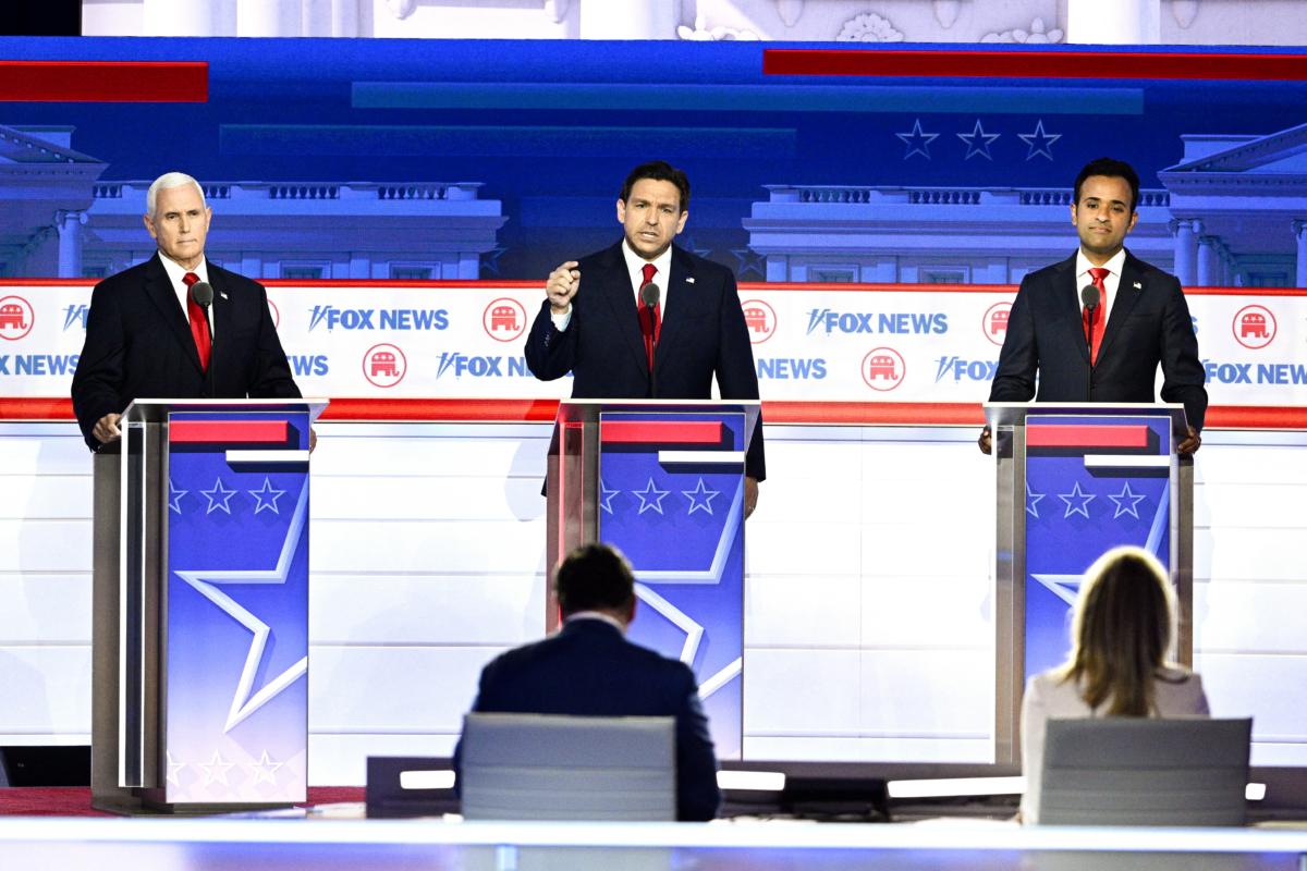 Florida Governor Ron DeSantis speaks, flanked by former U.S. Vice President Mike Pence and entrepreneur and author Vivek Ramaswamy, during the first Republican Presidential primary debate in Milwaukee, Wis., on Aug. 23, 2023. (Brendan Smialowski/AFP via Getty Images)