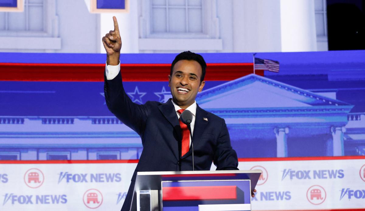  Entrepreneur and author Vivek Ramaswamy waves as he arrives to take part in the first Republican presidential primary debate at the Fiserv Forum in Milwaukee, Wis., on Aug. 23, 2023. (Kamil Krzaczynski/AFP via Getty Images)