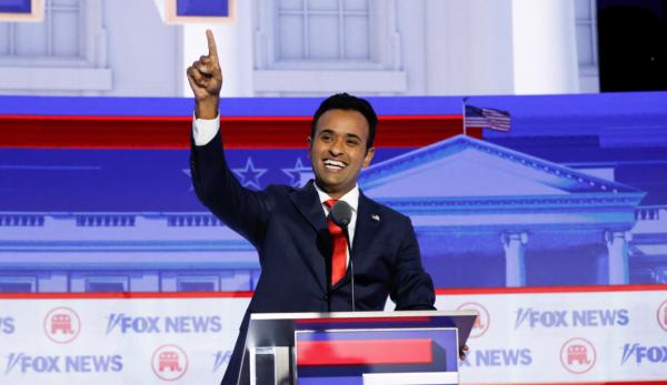 Entrepreneur and author Vivek Ramaswamy waves as he arrives to take part in the first Republican Presidential primary debate at the Fiserv Forum in Milwaukee, Wis., on Aug. 23, 2023. (KAMIL KRZACZYNSKI/AFP via Getty Images)