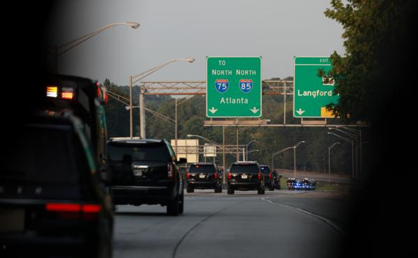 Former President Donald Trump rides in a motorcade as he travels to the Fulton County jail in Atlanta, Ga., on Aug. 24, 2023. (Joe Raedle/Getty Images)