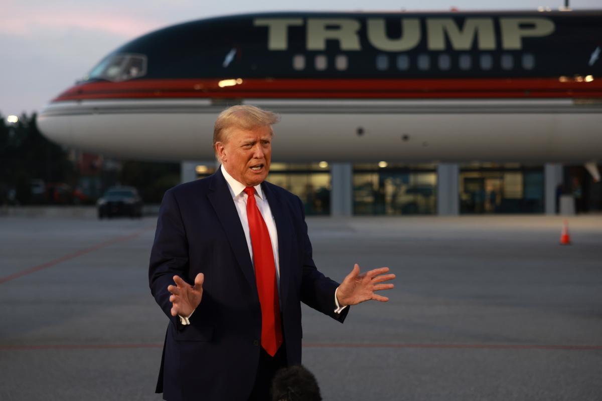 Former President Donald Trump speaks to reporters after being booked at the Fulton County jail on 13 charges related to the 2020 election, in Atlanta, Ga. on Aug. 24, 2023. (Joe Raedle/Getty Images)