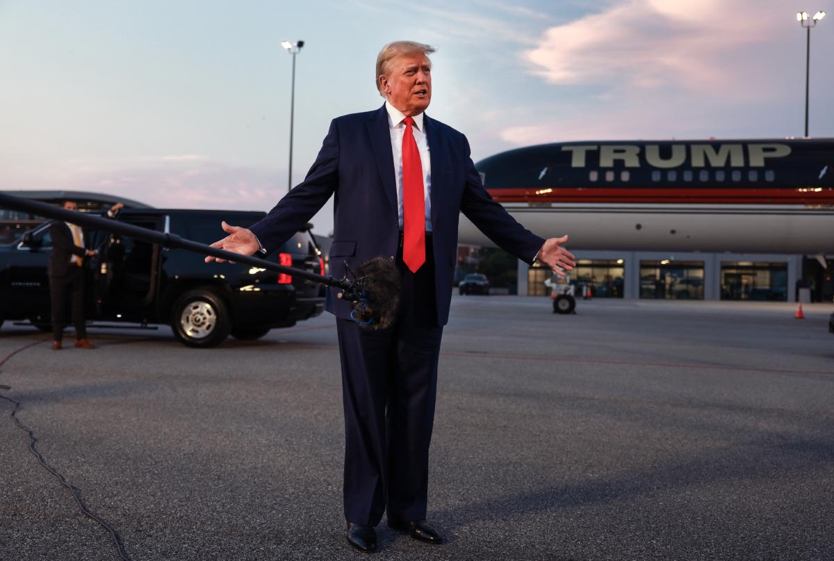 Former President Donald Trump speaks to reporters after being booked at the Fulton County jail on 13 charges related to the 2020 election, in Atlanta, Ga. on Aug. 24, 2023. (Joe Raedle/Getty Images)