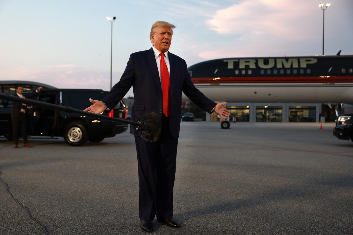 Former President Donald Trump speaks to the media at Atlanta Hartsfield-Jackson International Airport after being booked at the Fulton County jail in Atlanta, Ga., on Aug. 24, 2023. (Joe Raedle/Getty Images)