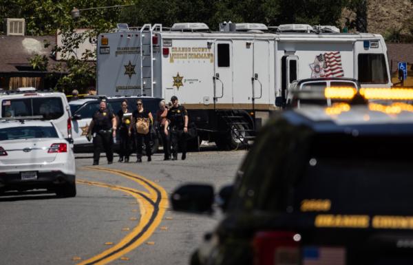 Law enforcement officers investigate the crime scene of a mass shooting at Cooks Corner restaurant in Trabuco Canyon, Calif., on Aug. 24, 2023. (John Fredricks/The Epoch Times)