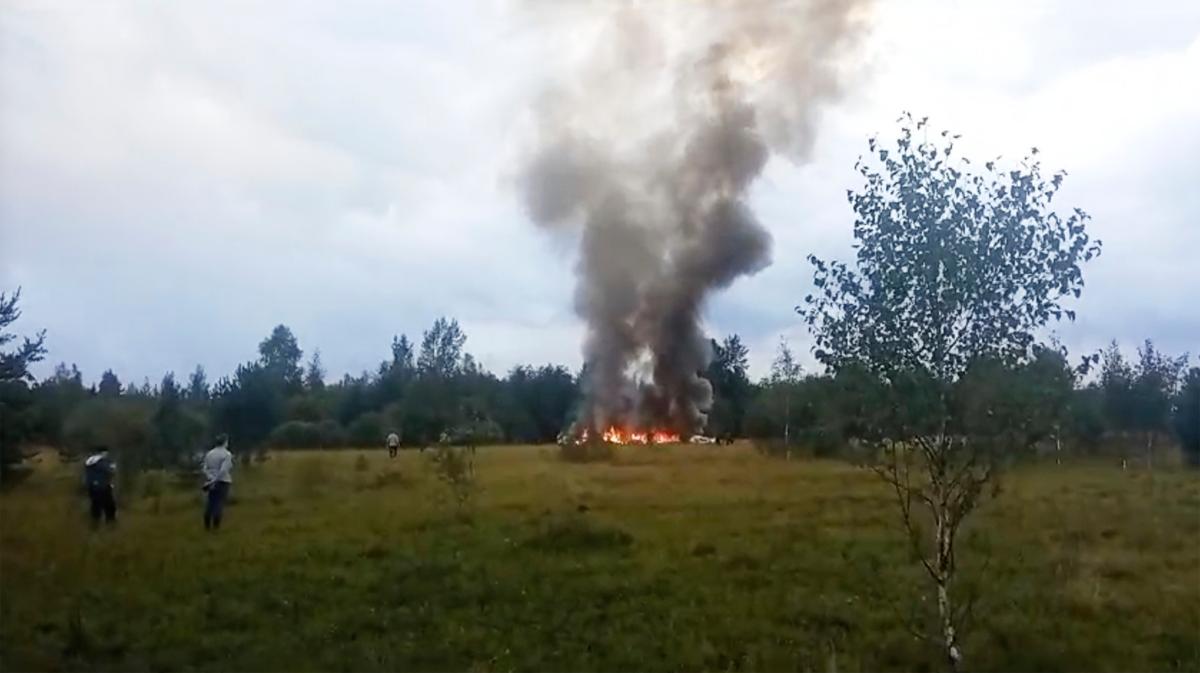 In this image taken from video, smoke and flames rise from a crashed private jet reportedly carrying Wagner leader Yevgeny Prigozhin, near the village of Kuzhenkino, Russia, on Aug. 23, 2023. (AP Photo)