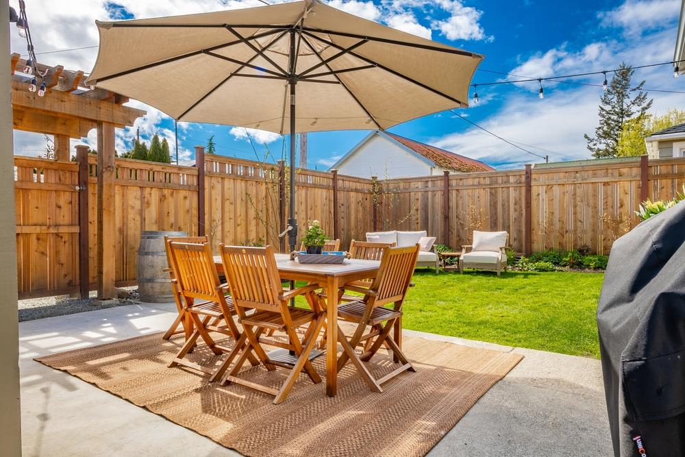 A shaded patio provides a cool, welcoming place to relax in the summer.(Sheila Say/Shutterstock)